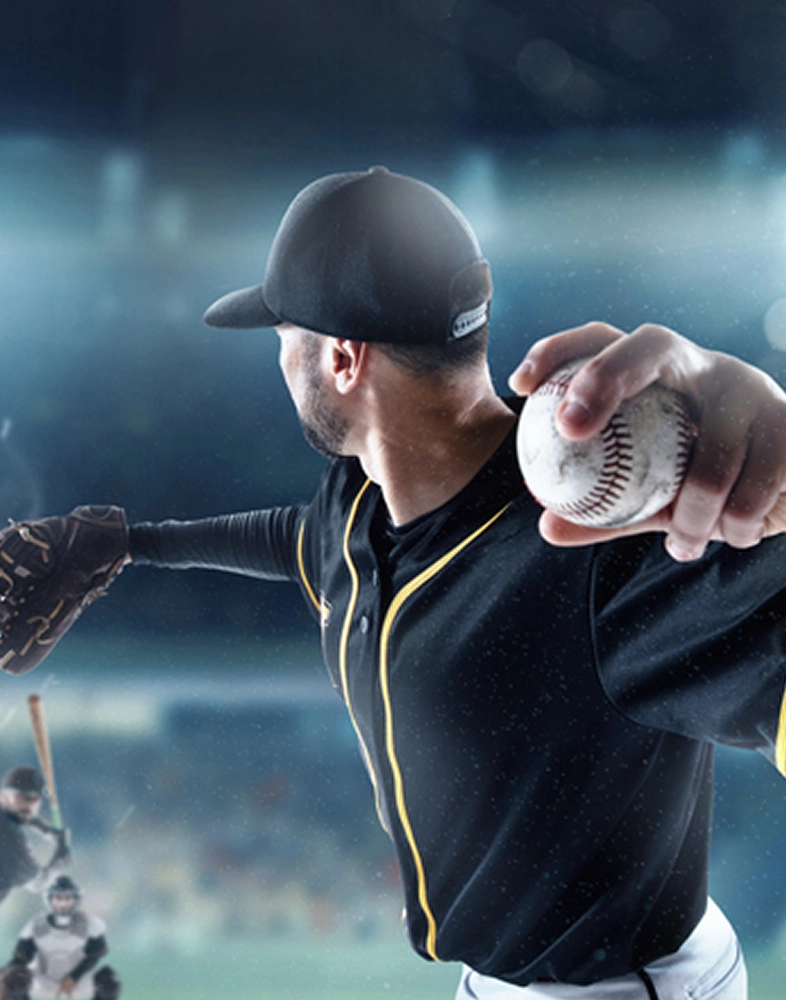 A baseball pitcher winding up.